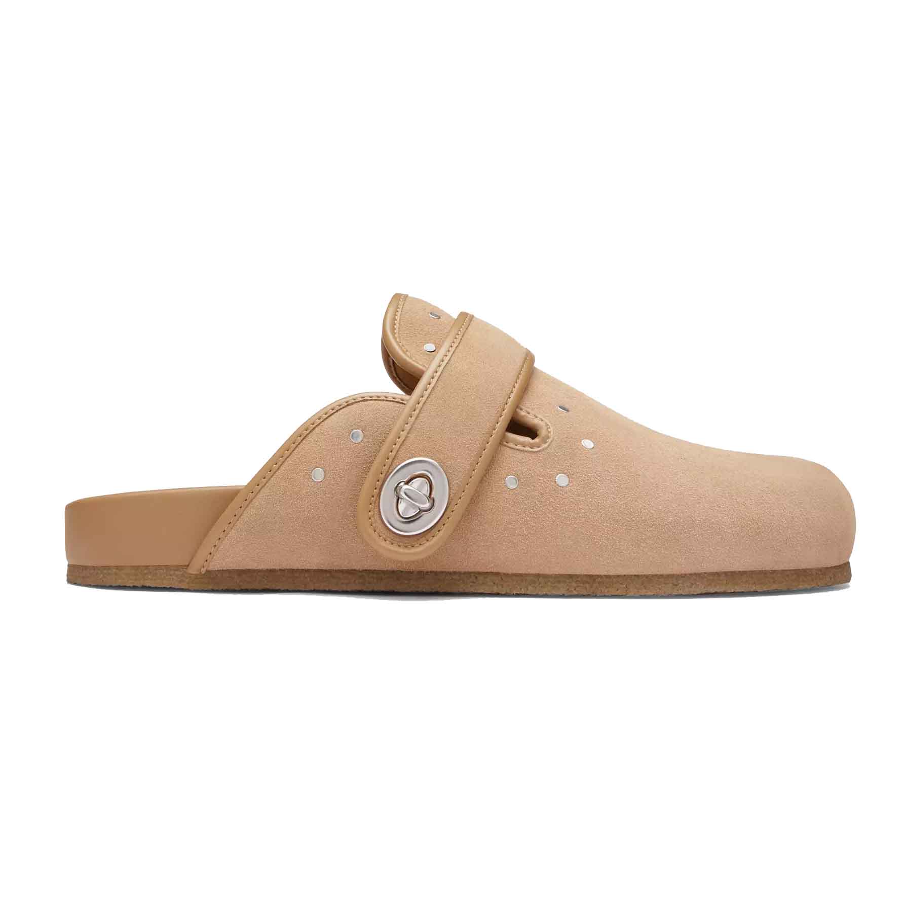 Coach Outlet Suede Clogs with Rivets are tan slip-on shoes featuring a suede upper with small rivet accents and a metallic logo clasp on the adjustable strap. They have a flat sole for comfort.