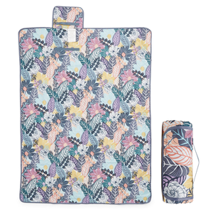 A floral-patterned yoga mat alongside a rolled-up version of the same design.