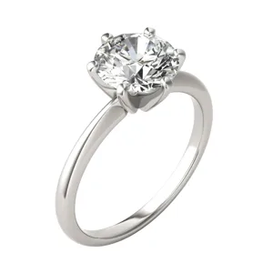 A silver engagement ring with a round, brilliant-cut diamond set in a classic solitaire style.