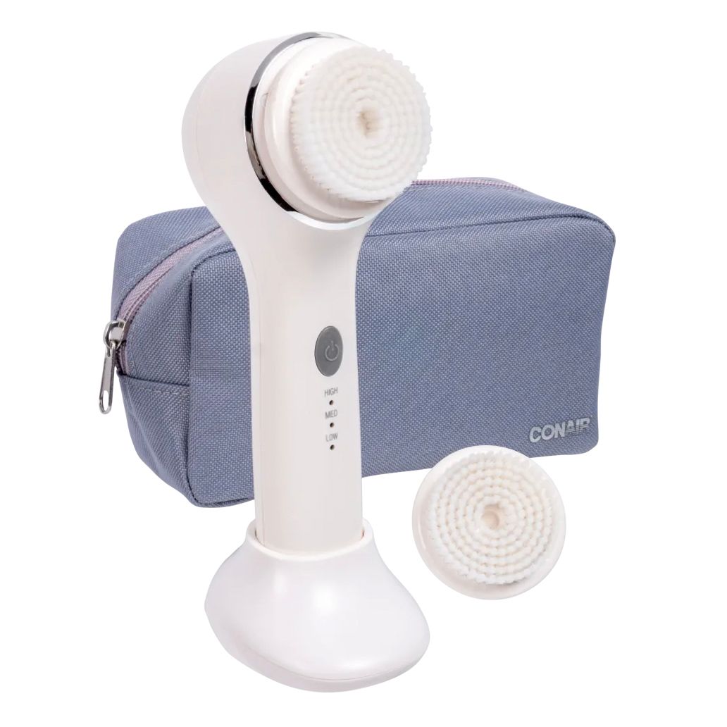 The Conair Sonic Facial Brush Kit includes a white handheld facial brush with replaceable brush heads, featuring high, medium, and low settings, and a blue zippered carrying case.