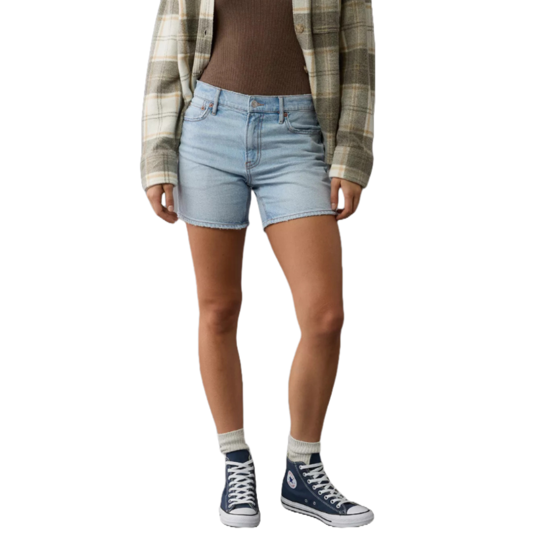 Light blue, super high-waisted relaxed denim shorts with a casual fit, featuring a button and zip closure. Paired with high-top sneakers, socks, and a plaid shirt over a brown top.