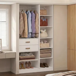 A tidy closet features hanging clothes, drawers, and shelves with handbags, woven baskets, folded clothes, and shoes.