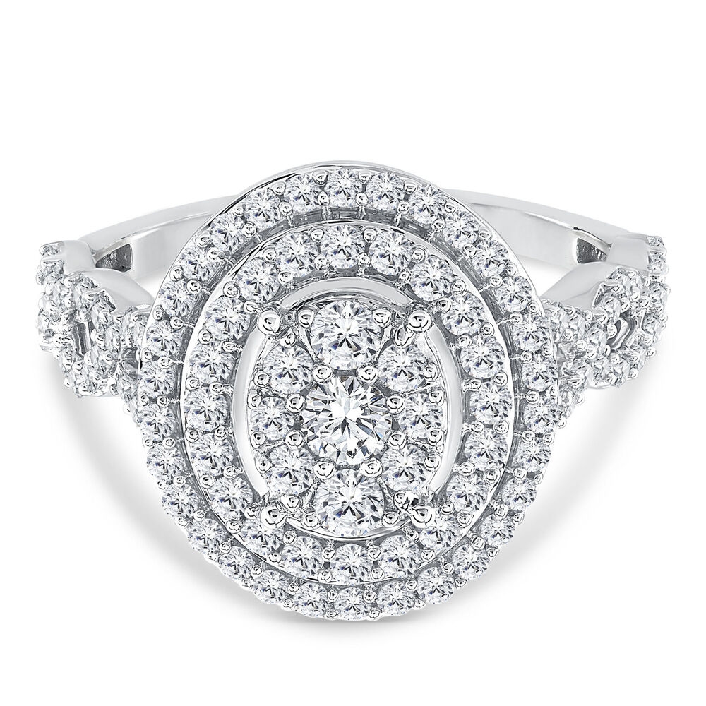 A white gold engagement ring with a 1-carat diamond in a halo setting, featuring a central diamond surrounded by two rows of smaller diamonds in an oval shape. The band also has smaller diamonds, enhancing its sparkle and elegance.