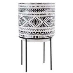 Black and white planter with geometric patterns on a metal stand.