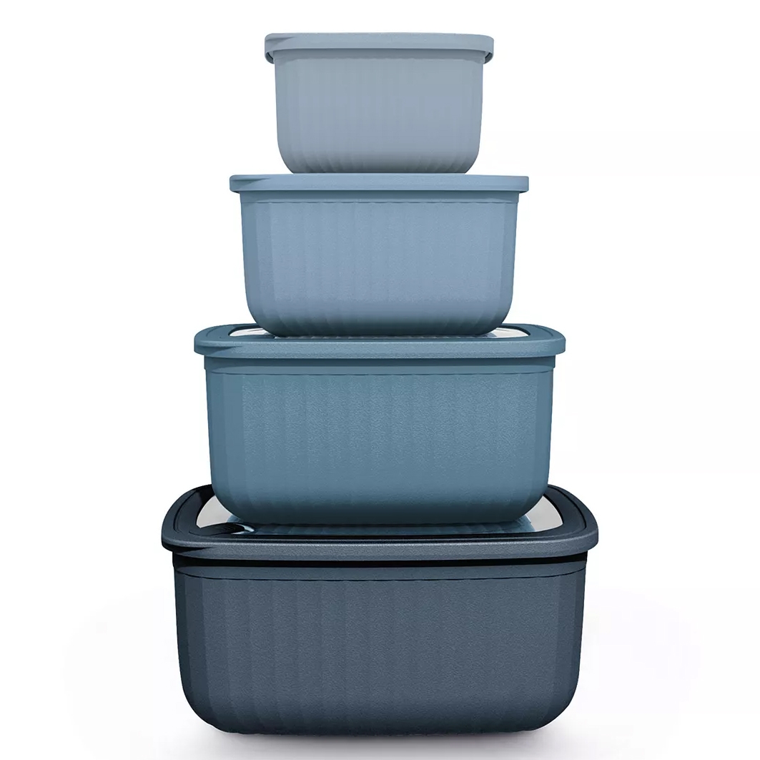 A set of four nesting blue storage containers with lids, each container slightly larger than the one above it, designed for space-saving organization.