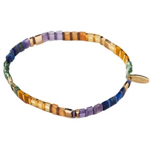 Colorful beaded stretch bracelet featuring small square beads in various hues like blue, green, purple, and orange, with a small gold tag attached.