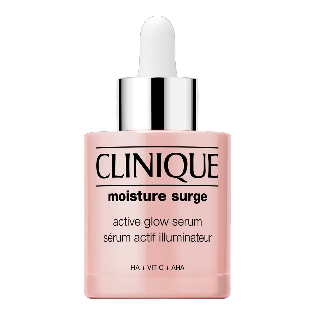 Clinique Moisture Surge Active Glow Serum is a lightweight serum designed to hydrate and illuminate the skin, featuring HA, Vitamin C, and AHA. It comes in a sleek dropper bottle with a pink tint and silver cap.