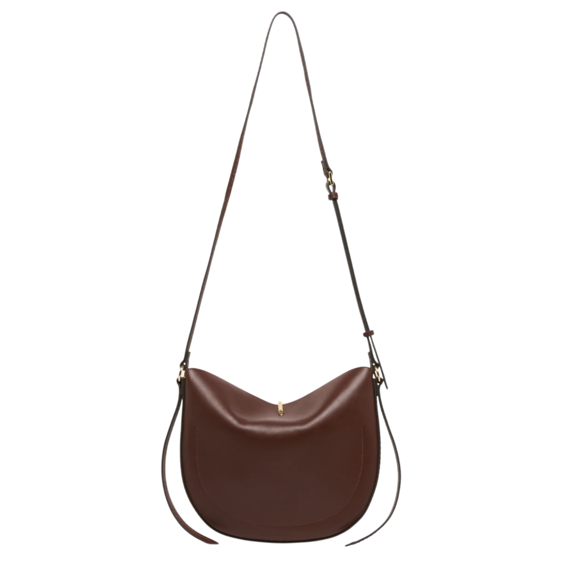 A brown leather saddle bag with a long adjustable strap and minimal gold hardware.