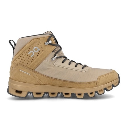 Beige high-top hiking shoes with a rugged, cushioned sole and black laces, featuring perforated details and a logo on the side. Suitable for outdoor activities.