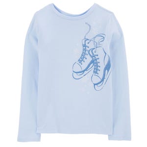 Light blue long-sleeve tee featuring a graphic of hanging ice skates with subtle snowflakes.
