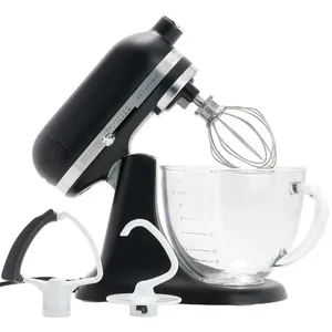 Black stand mixer with whisk attachment, accompanied by a dough hook and flat beater, and a glass mixing bowl with measurement marks.