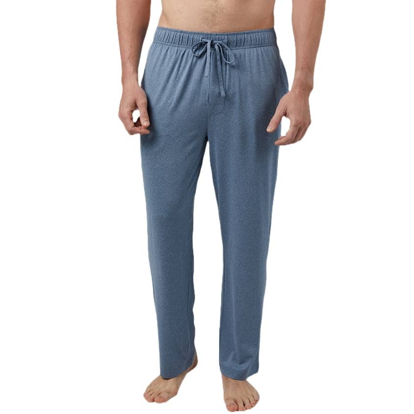 Blue drawstring lounge pants on a barefoot person, showcasing a comfortable, relaxed fit.