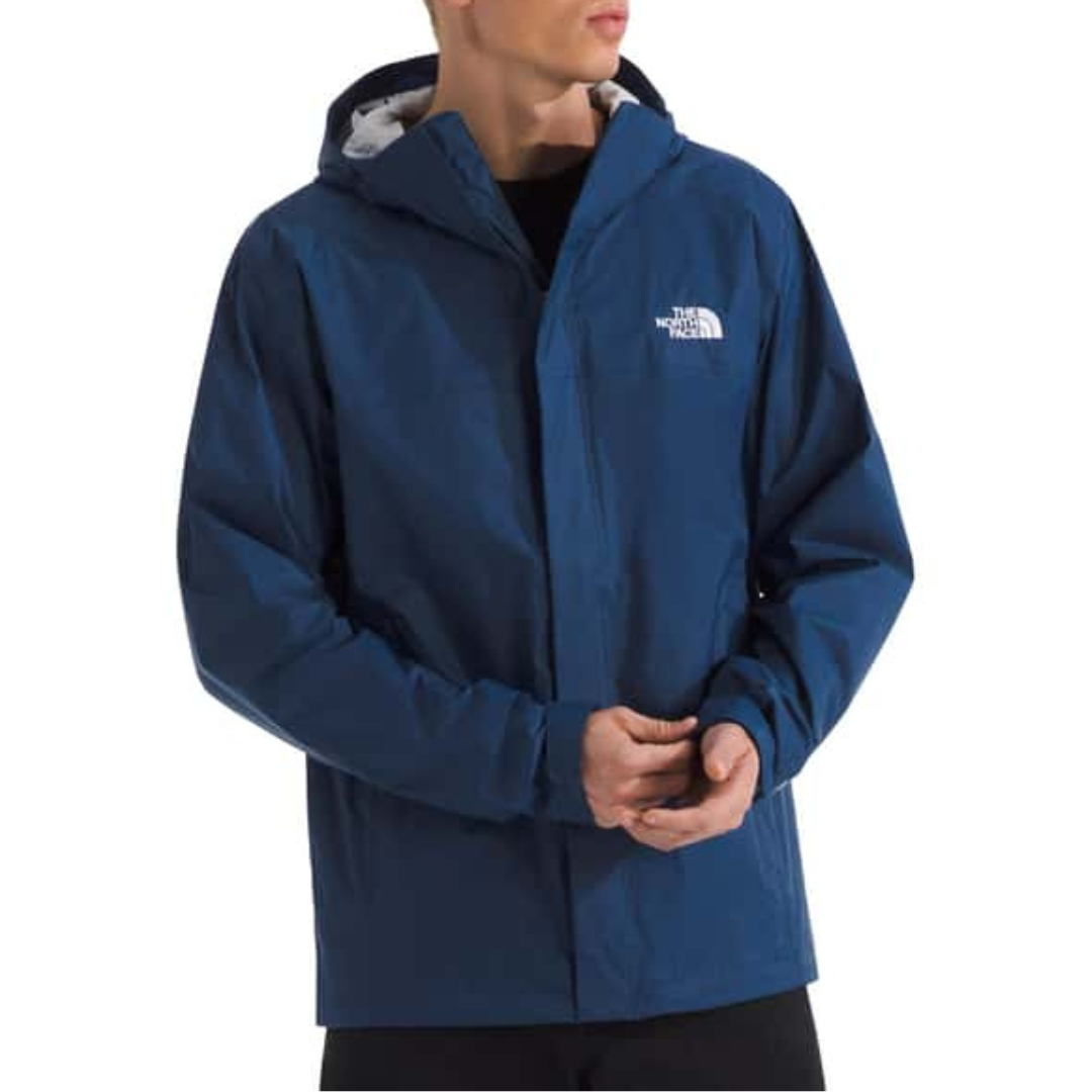 A person wearing a blue The North Face hooded jacket.