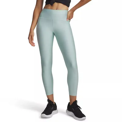 A model wears light blue high-waisted ankle-length leggings paired with black athletic shoes.