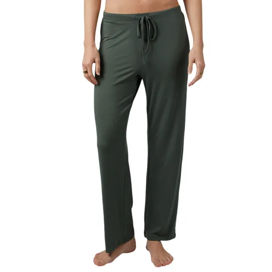 Dark green drawstring lounge pants with a relaxed fit, shown on a person standing barefoot.