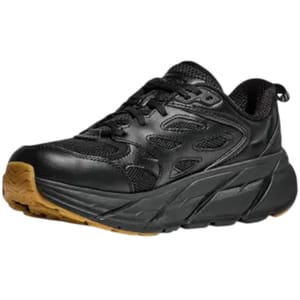 A black athletic shoe with a chunky sole and a gum-colored outsole, featuring a mesh and leather upper for breathability and durability, designed for comfort and support.