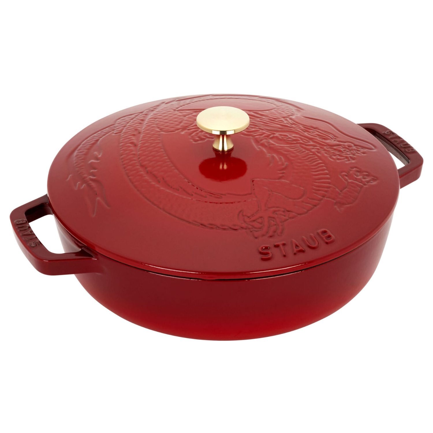 Red 9.5\“ cast iron braiser with a dragon-embossed lid, gold-tone knob, and \“STAUB\“ branding on the handles.