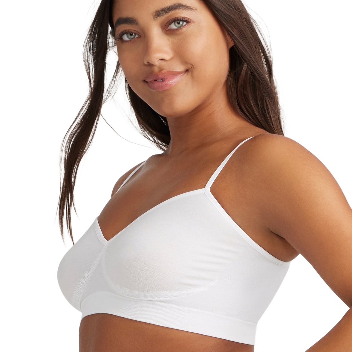 A woman wearing a white, seamless, thin-strap bralette with soft, contoured cups.