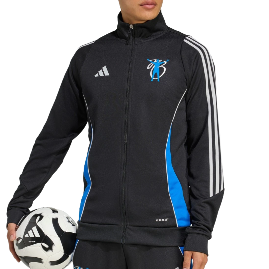 A person wearing a black Adidas track jacket with blue accents and white stripes is holding a soccer ball. The jacket features an \“AEROREADY\“ label and a logo on the chest.
