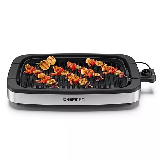Electric indoor grill by Chefman with a rectangular design, featuring skewered vegetables and meat.