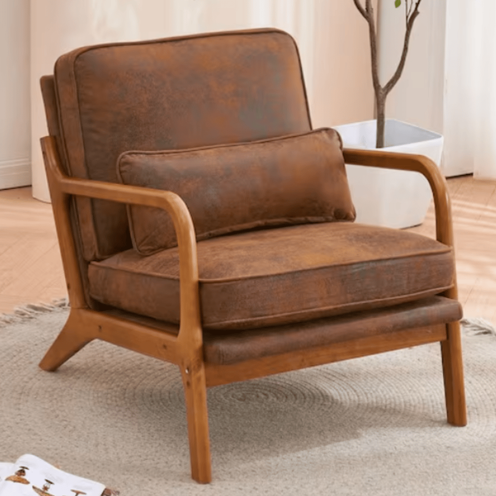 A brown armchair with a wooden frame and a matching lumbar cushion is placed on a light-colored circular rug.