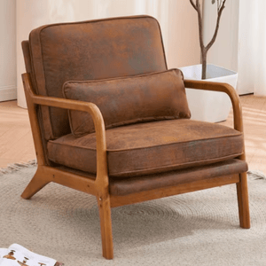 A brown armchair with a wooden frame and a matching lumbar cushion is placed on a light-colored circular rug.