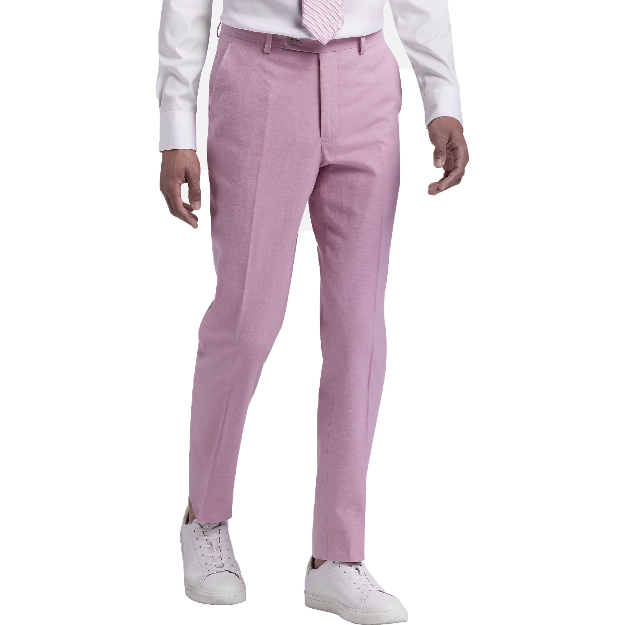 A person is wearing light pink dress pants with a white dress shirt and matching tie, paired with white sneakers.