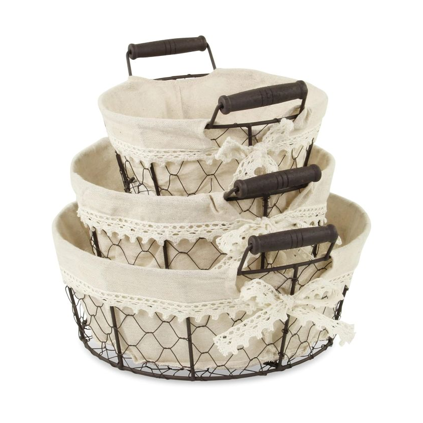 Three wire baskets with handles, lined with beige fabric and lace trim, stacked inside each other.