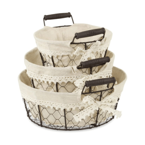 Three wire baskets with handles, lined with beige fabric and lace trim, stacked inside each other.