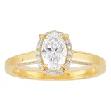A gold ring featuring an oval-cut diamond center stone, surrounded by a halo of smaller diamonds, with additional diamonds set along the band.