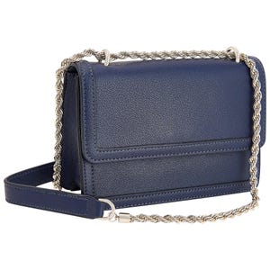 Navy blue crossbody bag with a pebbled texture, featuring a flap closure and a silver-tone rope chain handle.