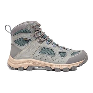 Vasque Breeze Hiking Boots are lightweight, mid-ankle boots featuring breathable mesh panels, durable synthetic overlays, and a grippy sole, ideal for hiking and outdoor activities. They are in a muted color palette with a rugged build.