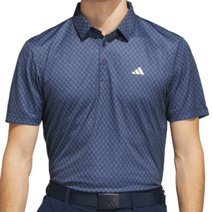 A blue, patterned short-sleeve polo shirt with a collar and buttons, featuring a logo on the chest.
