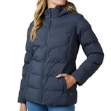A woman is wearing a dark blue, hooded puffer jacket with a front zipper and side pockets.