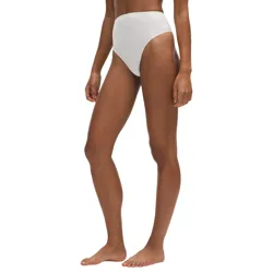 A person is shown wearing high-waisted, white bikini bottoms with a sleek, minimalist design.
