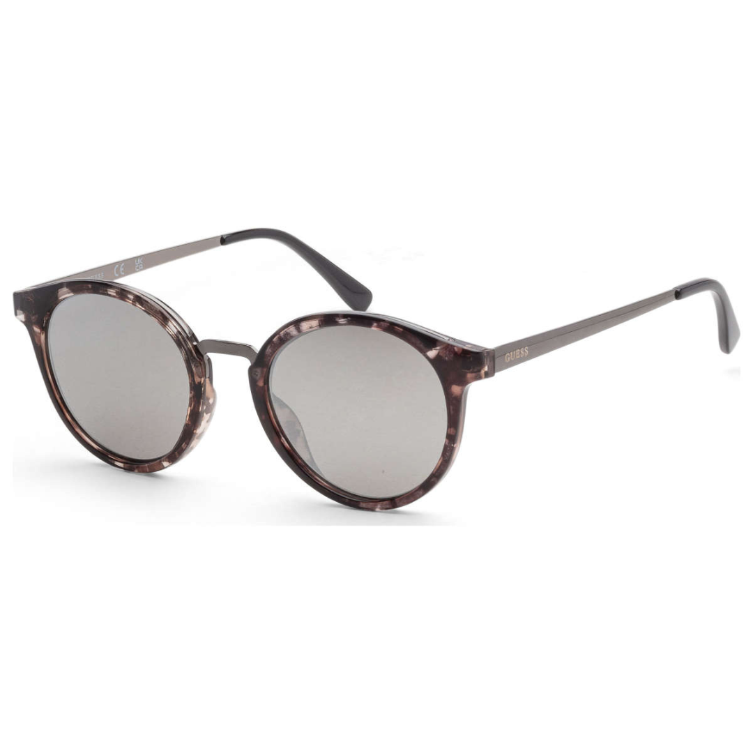 A pair of round, tortoiseshell-patterned sunglasses with gray lenses and slender metal arms.