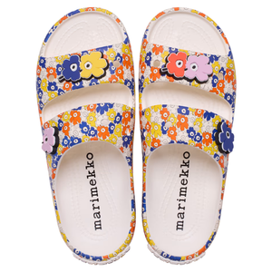 Colorful Marimekko sandals feature a floral print with adjustable straps and flower accents.
