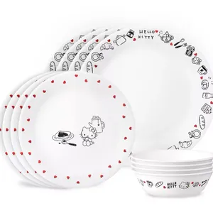 A Corelle Hello Kitty Dinnerware Set comprising white plates and bowls with red and black accents featuring Hello Kitty graphics along the rims.