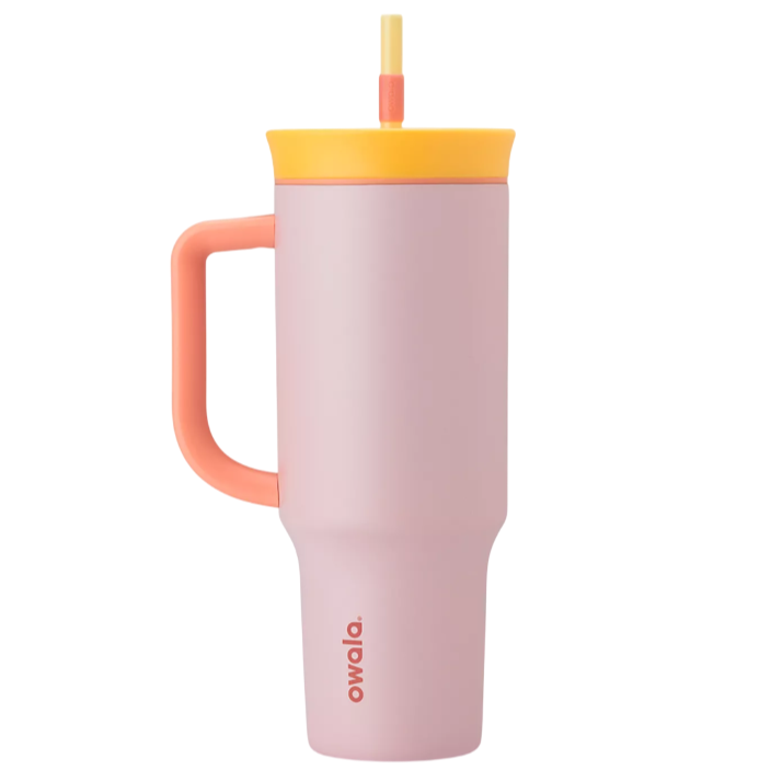 A pink and orange insulated travel mug with a handle, featuring a yellow lid and straw.