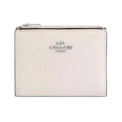 A small, light-colored Coach wallet with a zippered compartment and the brand logo on the front.