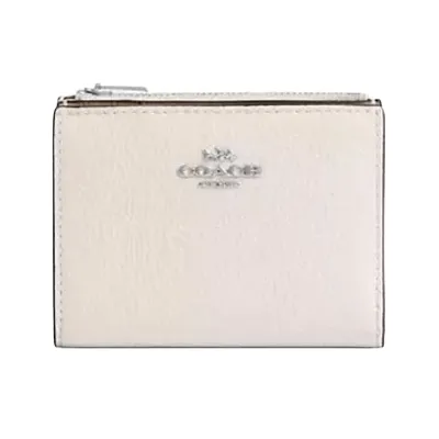 A small, light-colored Coach wallet with a zippered compartment and the brand logo on the front.