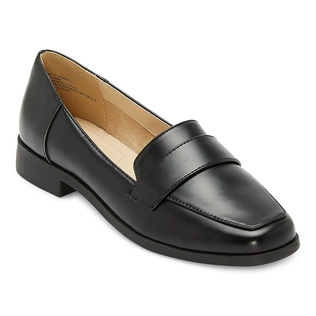 A black leather loafer with a low heel and a strap across the vamp.