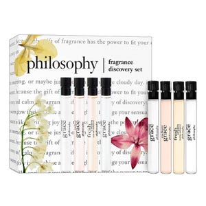 Philosophy fragrance discovery set featuring five sample-sized scents, each in a slim, transparent vial with black caps and labeled \“Grace.\“ The set is attractively packaged with floral graphics.