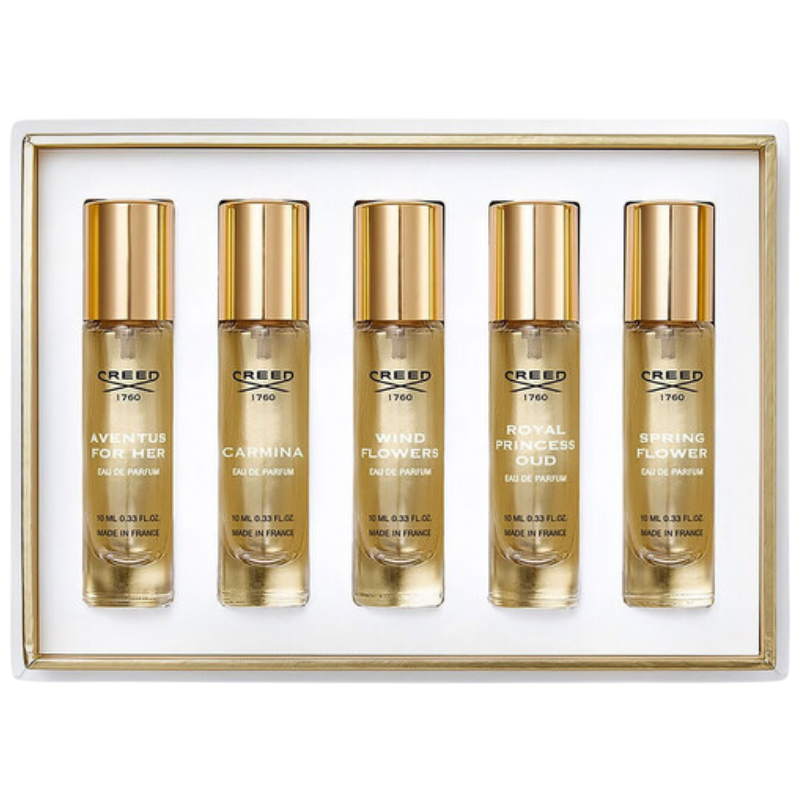 A fragrance gift set by Creed containing five 10ml bottles of Eau de Parfum: Aventus for Her, Carmina, Wind Flowers, Royal Princess Oud, and Spring Flower. Made in France.