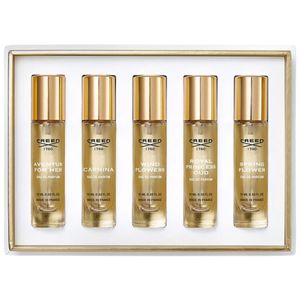 A fragrance gift set by Creed containing five 10ml bottles of Eau de Parfum: Aventus for Her, Carmina, Wind Flowers, Royal Princess Oud, and Spring Flower. Made in France.