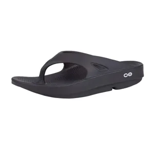 A black ergonomic thong sandal with a thick sole and textured footbed, featuring a minimalist design with a small white logo on the side.