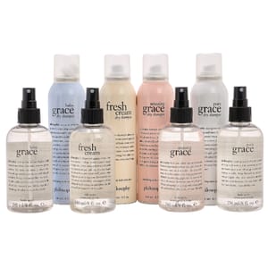 A collection of Philosophy body spritzes and dry shampoos, including scents like Baby Grace, Fresh Cream, Amazing Grace, and Pure Grace, are displayed in spray and aerosol bottles.