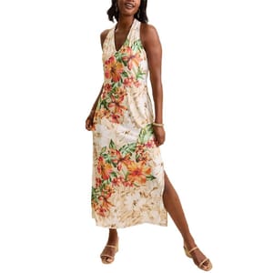 A tropical-themed maxi dress featuring a halter neckline with a floral pattern in vibrant colors, perfect for warm weather.