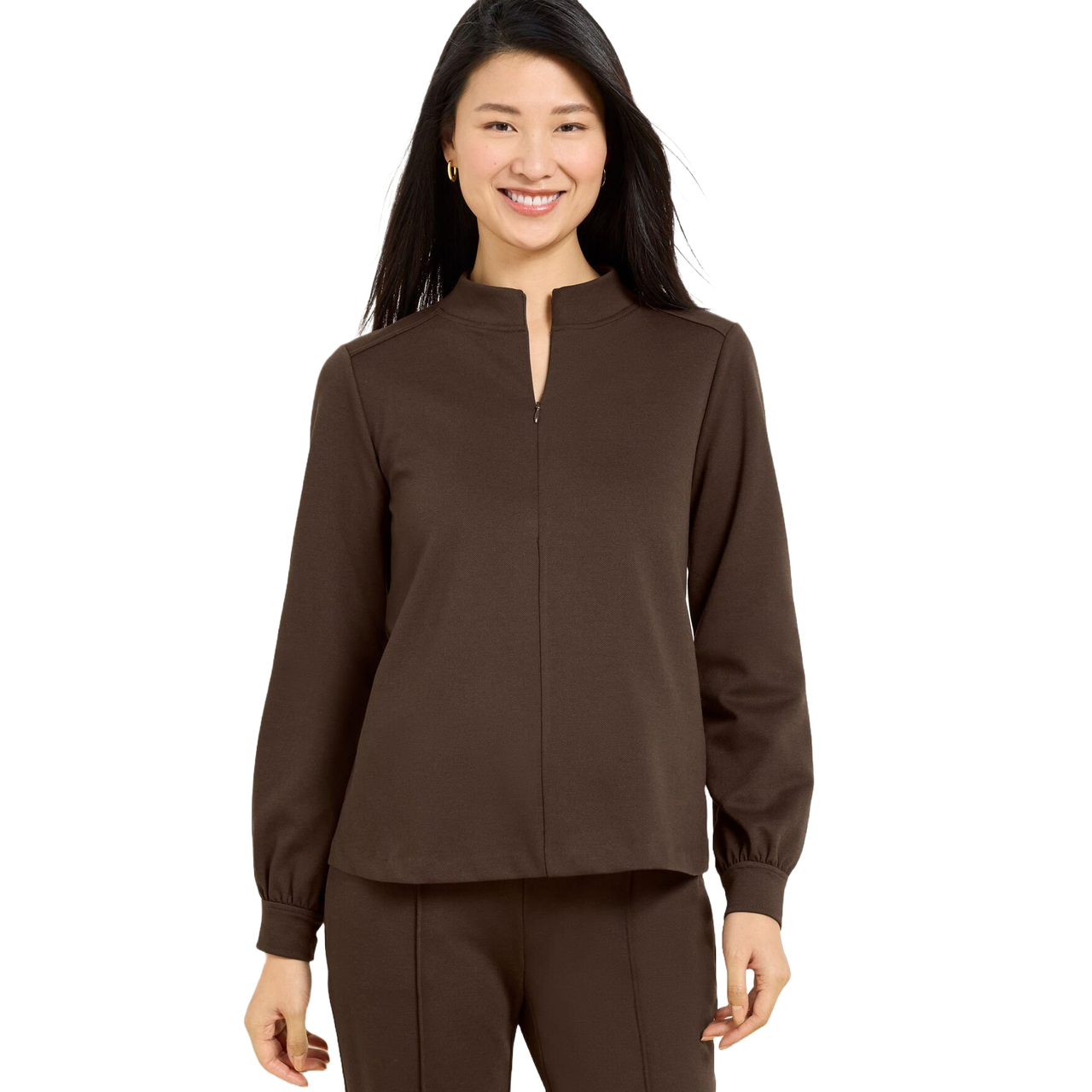 A woman is wearing a brown long-sleeve top with a keyhole neck and matching pants.