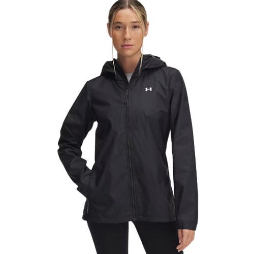 A woman in a black Under Armour hooded jacket with long sleeves and a front zipper, featuring the brand logo on the chest.